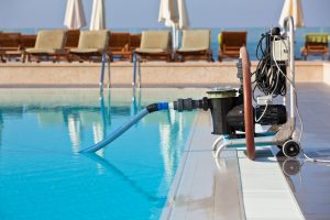 Cleaning pump working with a swimming pool. Horizontal shot