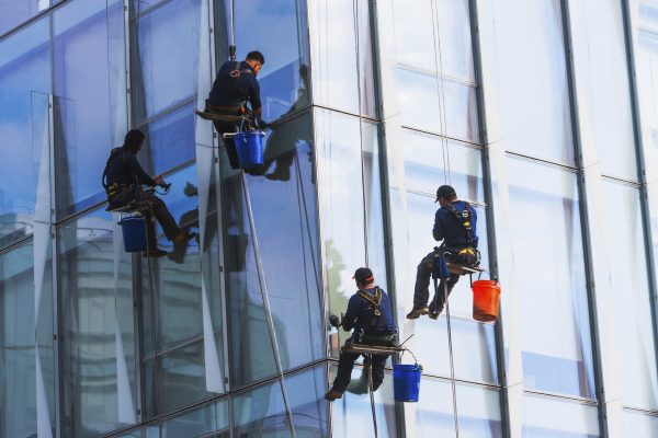 Window cleaners working on a high-rise building